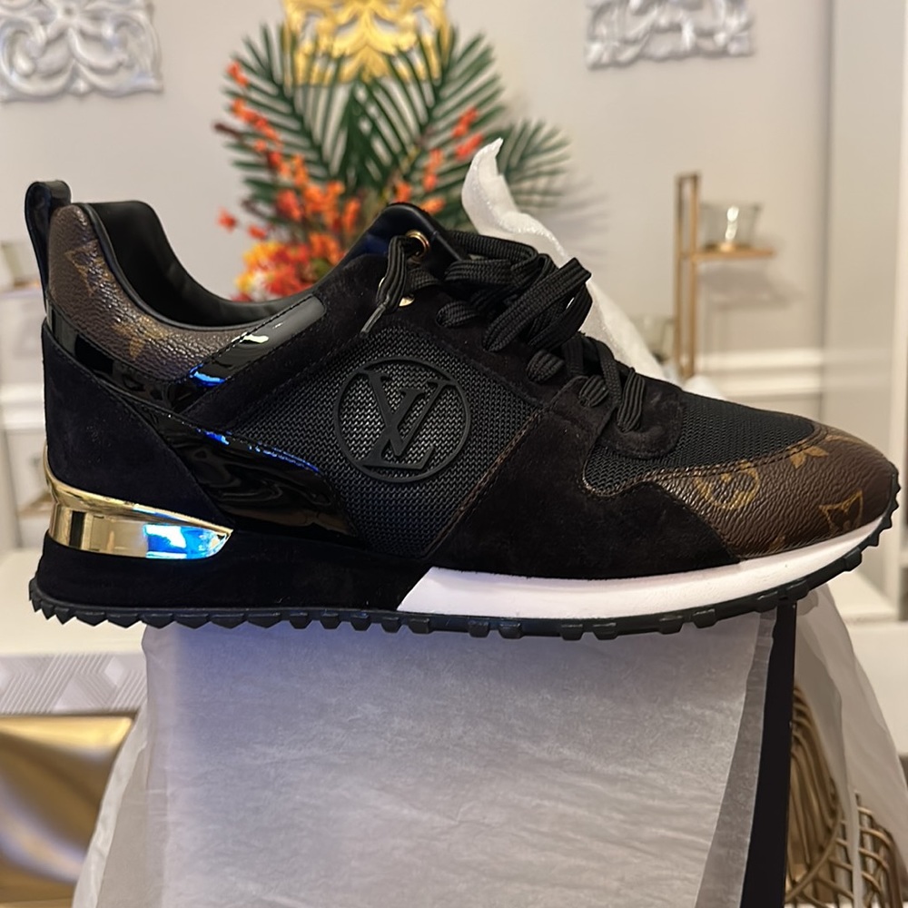 Authentic Louis Vuitton (Run Away Sneaker) New never worn still in original box.